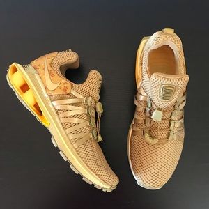nike shox gravity metallic gold women's shoe